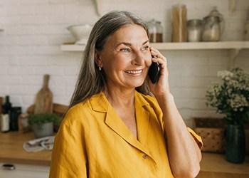 Woman smiling while talking on phone