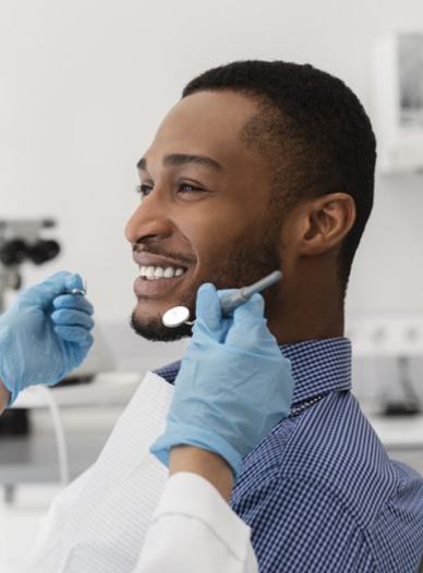 young man attending a dental checkup and cleaning in Moses Lake