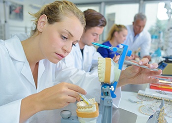 a dental lab technician making dentures