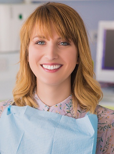 woman with bangs smiling